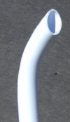 The curved end of a curved dip tube