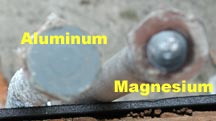 A photo showing the differences between aluminum and magnesium anodes; the latter have a bump on the hex nut