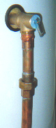 A union connects a drain line to a temperature/pressure relief valve, permitting easy replacement of the valve if it should fail